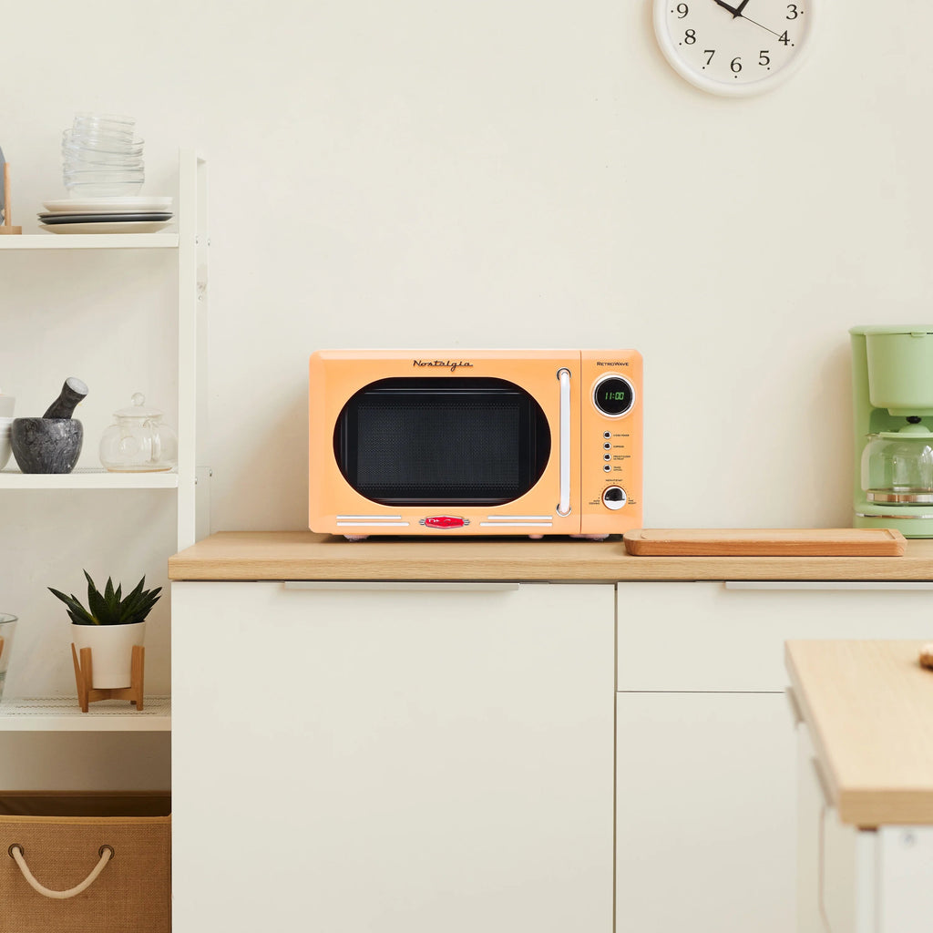 Nostalgia Retro Compact Countertop Microwave Oven 0.7 Cu. Ft. 700-Watts Orange