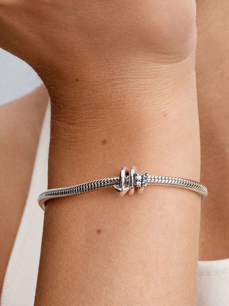 Twisting Arrow Charm