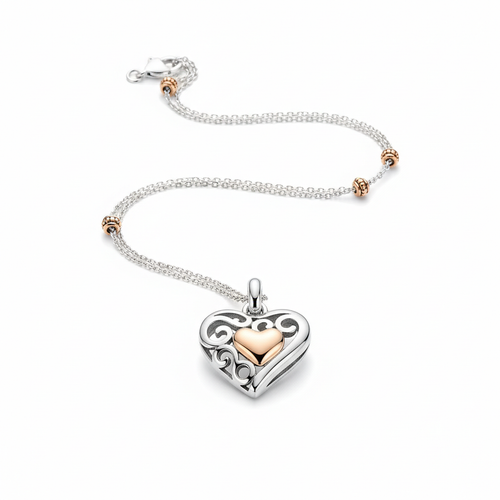 Sterling silver heart pendant necklace with rose gold accents